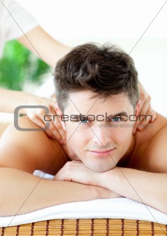 Smiling caucasian man having a back massage 