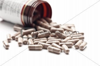 Medicinal pills poured out of the jar 