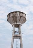 Distressed concrete water tower