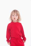 portrait of a boy in red with long blond hair - isolated on white