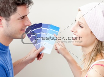Charming couple choosing color for a room 
