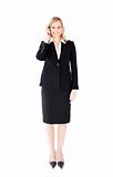 Smiling businesswoman talking on phone looking at the camera 
