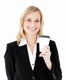 Smiling businesswoman holding a coffee against white background
