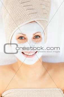 Portrait of a woman having a spa treatment in a health center with white cream