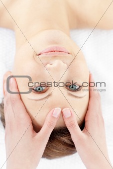 Cute young woman enjoying a facial massage
