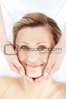 Beautiful woman receiving a facial massage 