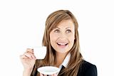 Elegant young businesswoman holding a cup of coffee 