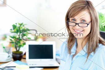 Blond businesswoman smiling at the camera 