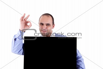 Young businessman holding a blackboard displaying the sign of success