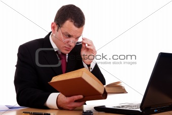 businessman on desk reading and studying