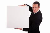 Businessman holding a white board, looking to camera