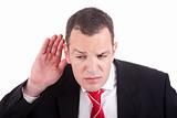 businessman, listening, viewing the  gesture of hand behind the ear