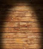 Distressed wooden surface lit dramatically