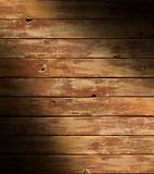 Distressed wooden surface lit diagonally