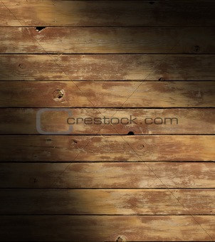 Distressed wooden surface lit diagonally