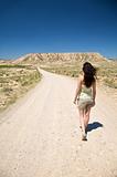 hiking woman at desert road