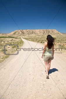 hiking woman at desert road