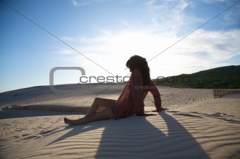 sitting at dune against sun