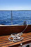 wooden sailboat boat deck blue sky ocean sea