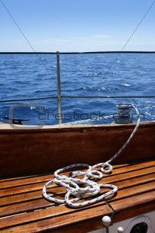 wooden sailboat boat deck blue sky ocean sea