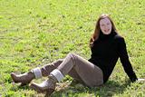 redhead woman sit meadow grass corduroy pants