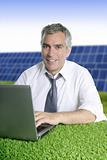 senior businessman work green grass solar plates