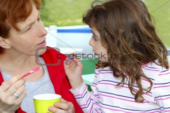 mother and daughter eating ice cream talking