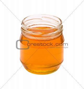 Jar of honey isolated on white background