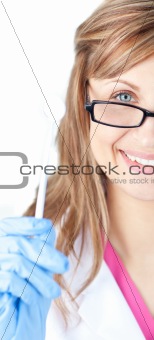 Charming female dental surgeon holding  a speculum