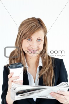 Elegant businesswoman reading newspaper holding coffee 