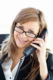 Assertive businesswoman talking on phone looking at the camera 