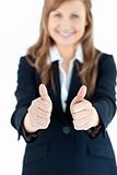 Close-up of an enthusiastic businesswoman with thumbs up 