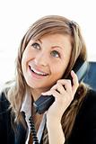 Radiant businesswoman talking on phone in her office 