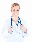 Friendly female doctor holding a stethoscope smiling at the came