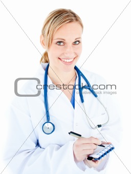 Smiling female doctor taking notes on her notepad 