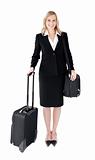 Smiling young businesswoman  holding a suitcase 
