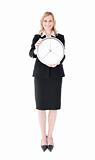 Glowing businesswoman holding a clock 