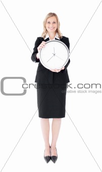 Glowing businesswoman holding a clock 
