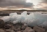 Ice thaws on bank of lake