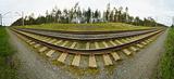 Wide-angle panoramic photo of railroad tracks