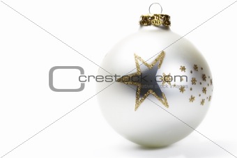 dull white christmas ball with golden stars