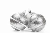 three clear christmas balls with glitter stripes