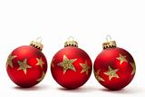 three red dull christmas balls with golden glitter stars