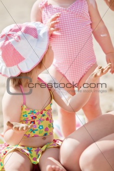 Close-up of a cute little girl at the beach