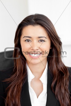 Portrait of a smiling asian businesswoman looking at the camera 