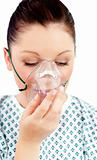 Diseased female patient wearing a oxygen mask 