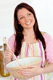 Positive woman cooking at home