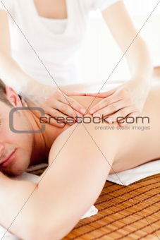 Resting man having a back massaga 
