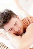  Attractive young man enjoying a back massage