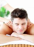 Portrait of a handsome man having a back massage
